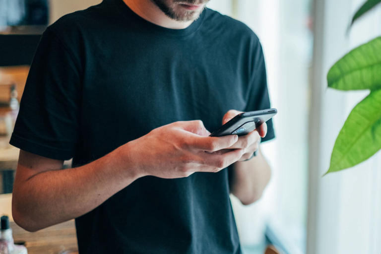 Man in Black Crew-neck Top Using Online Dating Apps