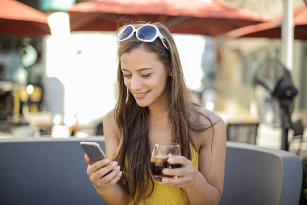 Woman Playing Online While Drinking