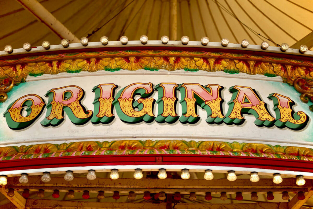 white and red wooden signage with Original word