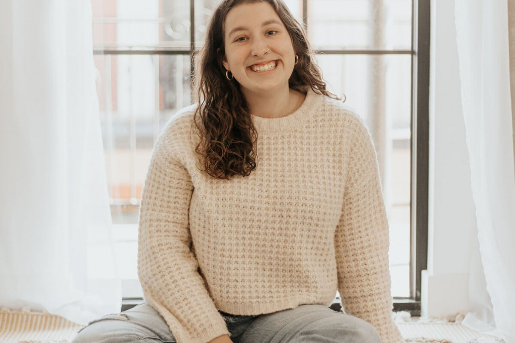 Plus Size Woman in Pink Sweater and Blue Denim Jeans